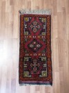Menší starožitný farebný ručne viazaný koberec 107 x 45 cm